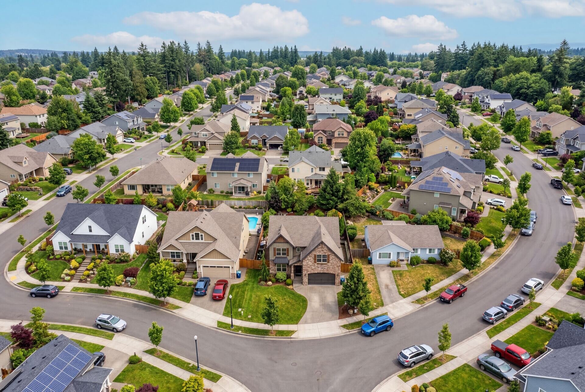 Solar-powered neighborhood with EV charging and rooftop installations representing Elevation Energy's vision